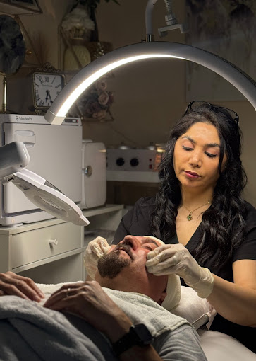 A woman getting her teeth checked by a dentist